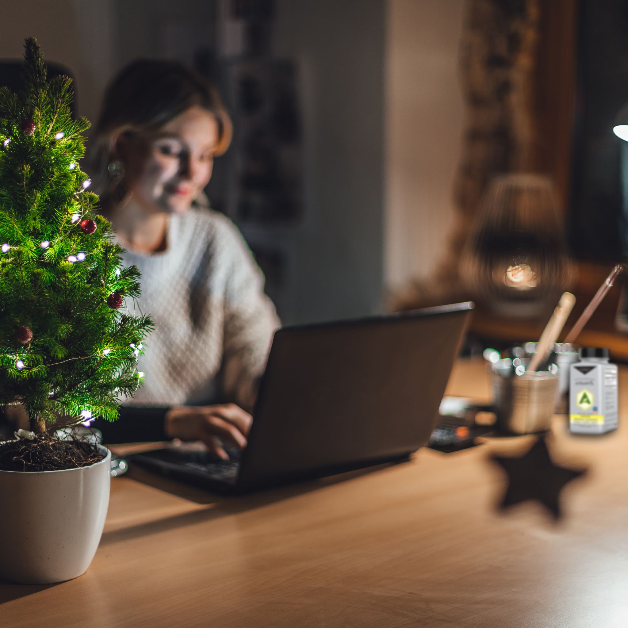 Woman Stressed on the computer during christmas time